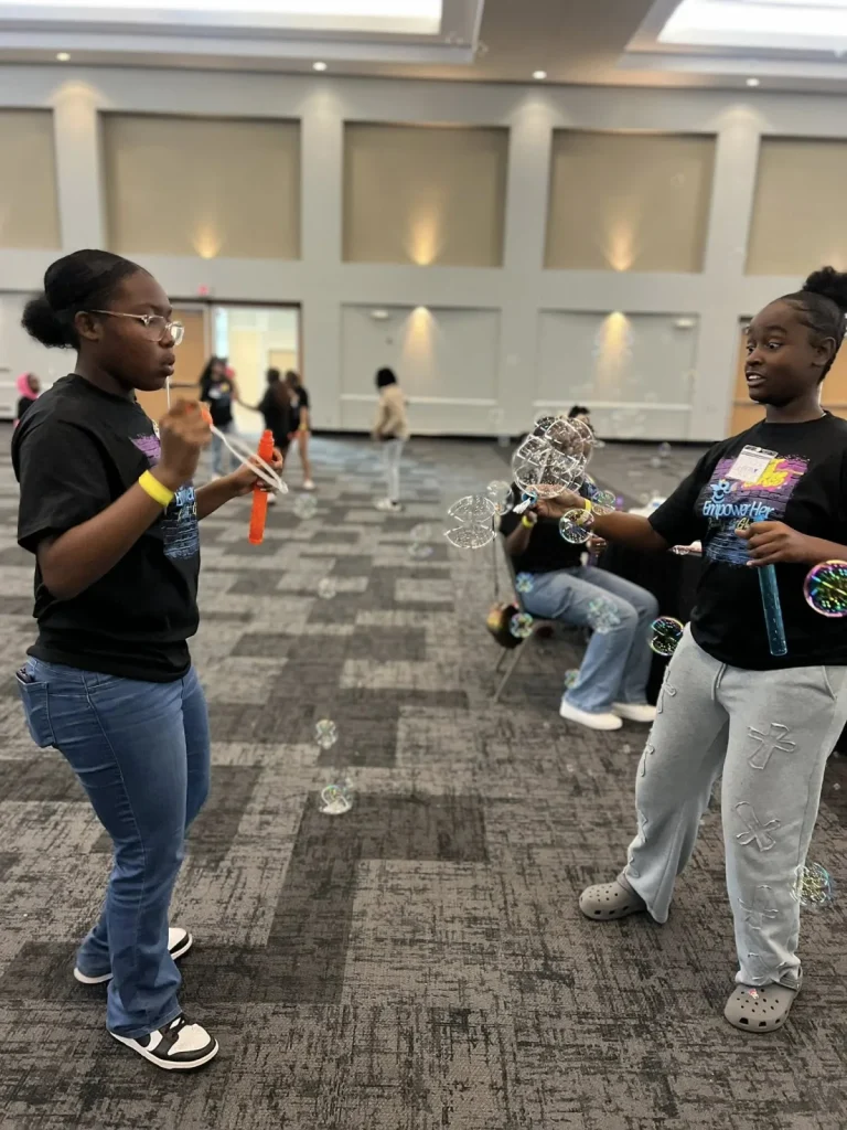 Girls in program shirts during an event