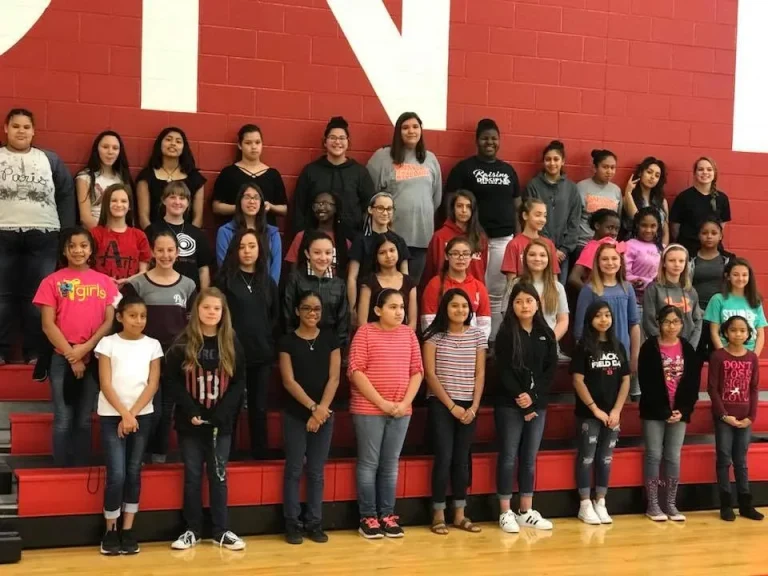 Girls photographed together on the bleachers
