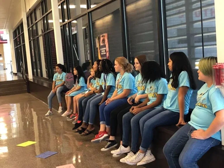 Girls sitting together between sessions