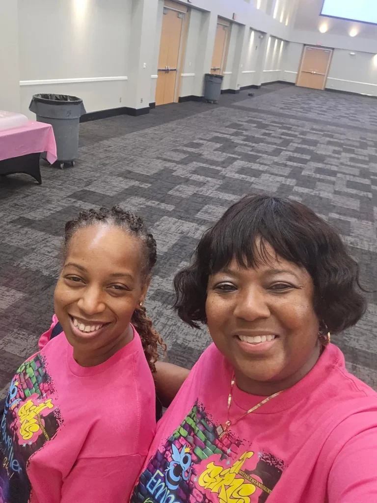 A girl and a volunteer at an event