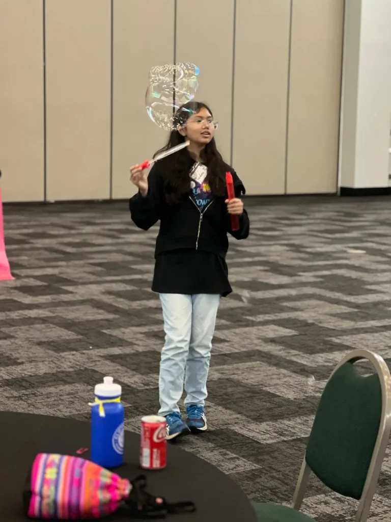 A girl presenting to the room