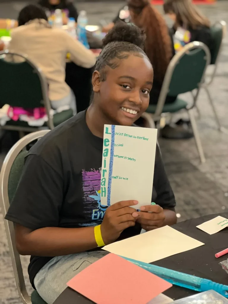 A girl shows the work she completed
