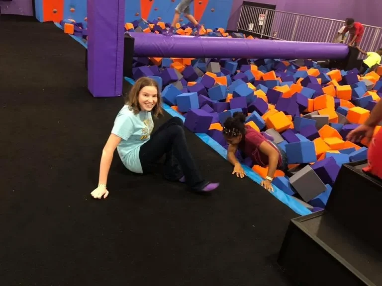 Girls at a trampoline park during a group outing